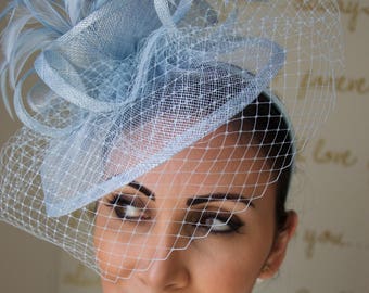 Light Blue Fascinator - "Noor" Light Blue Fascinator Hat Headband w/Ribbon waves a light blue birdcage veil