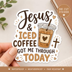 May include: A die-cut sticker featuring a plastic cup of iced coffee with a straw and a heart icon on the cup. The text reads Jesus & ICED COFFEE GOT ME THROUGH TODAY. The design includes small stars, hearts, and a cross in brown and tan colors.