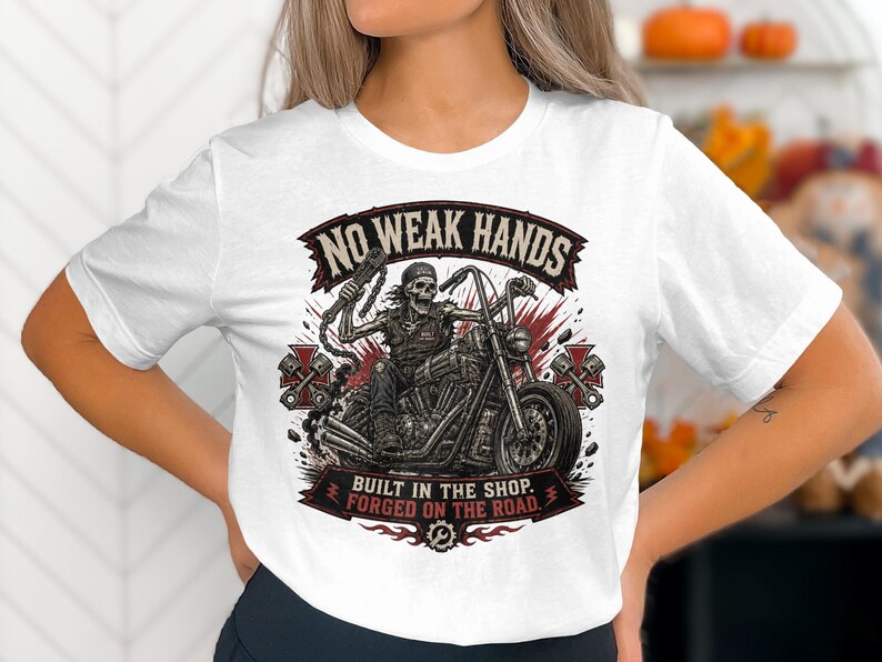 Skeleton biker on motorcycle with "No Weak Hands" text.