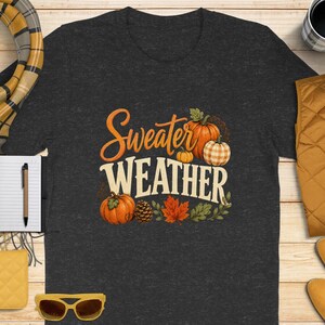 Charcoal t-shirt with "Sweater Weather" text and pumpkins.
