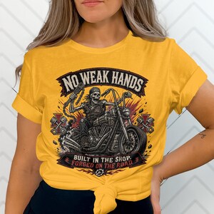Yellow t-shirt with graphic of skeleton on motorcycle and text.
