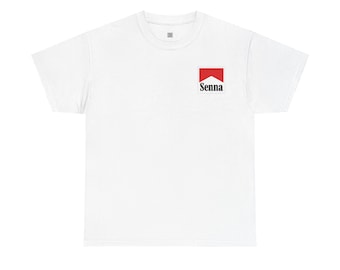 May include: A white short-sleeved t-shirt featuring a small rectangular graphic on the upper left chest. The graphic consists of a red chevron shape above the black text Senna, mimicking a classic racing-inspired logo design on the plain fabric.