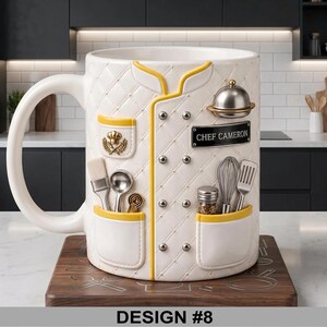 May include: White ceramic mug with a chef's coat design, featuring yellow trim and silver accents. The mug includes a nameplate that reads "CHEF CAMERON" and the text "DESIGN #8" at the bottom.
