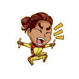 May include: A die-cut sticker featuring a cartoon character with brown hair in a top knot, wearing a yellow and red jumpsuit. The character is laughing with eyes closed, holding two drumsticks, with three yellow exclamation marks to the side.