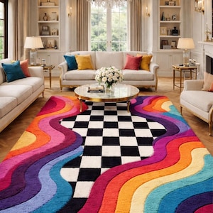 May include: A rectangular area rug featuring a central black and white checkered pattern flanked by wide, wavy bands of vibrant colors including red, orange, yellow, purple, and blue. The rug has a thick, textured pile and covers a wooden floor.