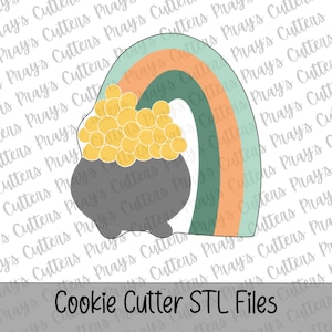 May include: A colorful illustration of a rainbow with a pot of gold and the text "Cookie Cutter STL Files". The rainbow has stripes of teal, orange, and green. The pot is gray and filled with yellow gold coins.