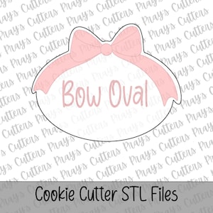 May include: A pink bow-shaped cookie cutter with the words "Bow Oval" in the center. The cutter is an oval shape with a bow at the top. The text "Cookie Cutter STL Files" is at the bottom.