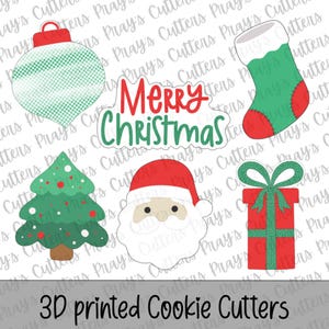 May include: A set of five 3D printed cookie cutters featuring a green and white patterned ornament, a red and green stocking, a green Christmas tree with red and white dots, a Santa Claus face, and a red gift box with a green bow and ribbon.