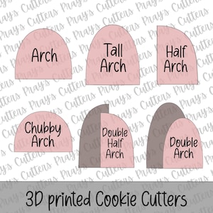 May include: A collection of 3D-printed cookie cutters in various arch shapes, including "Arch", "Tall Arch", "Half Arch", "Chubby Arch", "Double Half Arch", and "Double Arch". The cutters are in shades of pink and gray, with black text labels.