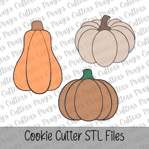 May include: Three pumpkin-shaped cookie cutters with black outlines. One is a tall orange gourd with a brown stem, one is a round beige pumpkin with a brown stem, and one is a round brown pumpkin with a green stem. Text reads Cookie Cutter STL Files.