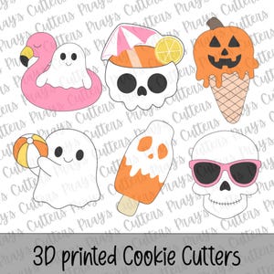 May include: A set of six 3D printed cookie cutters featuring a ghost in a pink flamingo float, a skull with a cocktail umbrella, a pumpkin ice cream cone, a ghost holding a beach ball, an orange popsicle, and a skull wearing pink sunglasses.