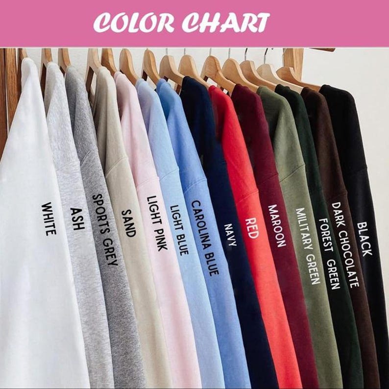 May include: A color chart displaying a variety of sweatshirt colors, including white, ash, sports grey, sand, light pink, light blue, Carolina blue, navy, red, maroon, military green, forest green, dark chocolate, and black. The text "COLOR CHART" is at the top.