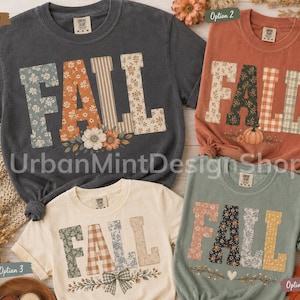 May include: Four short-sleeved t-shirts in charcoal, terracotta, cream, and sage green. Each shirt features the word FALL in large block letters with varied floral, plaid, and striped patterns. Decorative elements include pumpkins, bows, and foliage.