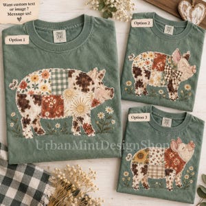 May include: Three sage green t-shirts featuring a patchwork pig graphic with floral, cow print, and gingham patterns. Each shirt displays a pig surrounded by small daisies. Text labels read Option 1, Option 2, and Option 3, with a note to message for custom text.