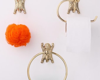 Juego de perchas de baño de latón con diseño de tigre: portarrollos, toallero y gancho de pared.