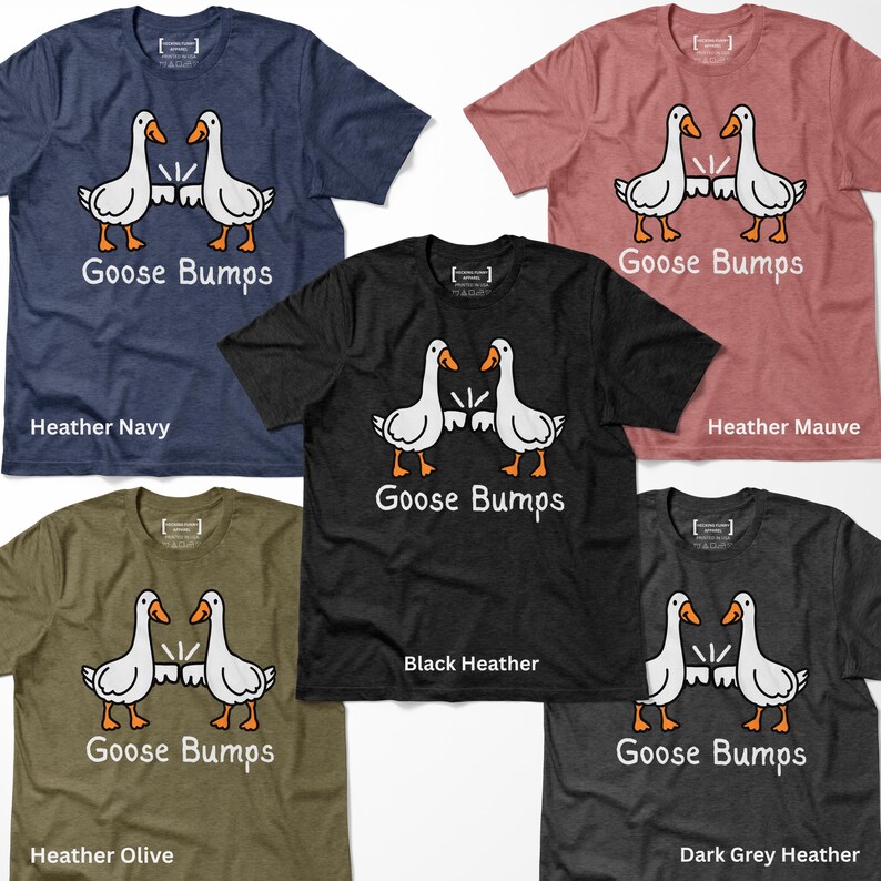 May include: Five t-shirts in different colours, each with a cartoon design of two geese facing each other and the text "Goose Bumps". The colours are navy, mauve, black, olive, and dark grey.