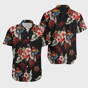May include: Black button-up short-sleeve shirt with a tropical floral and parrot print. The shirt features the word "SLAYER" in red and a pentagram symbol. The shirt is a casual style.