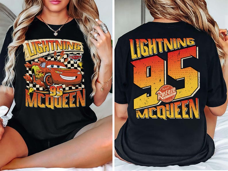 May include: Black t-shirt with a graphic of Lightning McQueen from the Cars film. The front design shows McQueen with the text "Lightning 95 McQueen". The back of the shirt features "Lightning 95 McQueen" in orange and yellow.