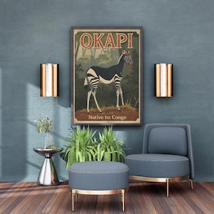 May include: A framed vintage-style poster featuring an okapi illustration with the word "OKAPI" at the top. The poster is displayed above a blue chair and ottoman with gold trim. The text "Native to: Congo" is at the bottom.