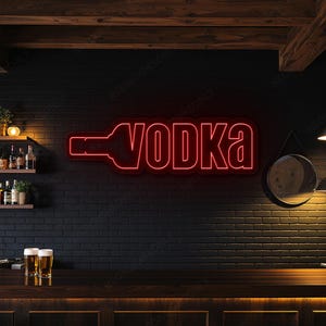 May include: A red neon sign shaped like a vodka bottle with the word "VODKA" in bold letters. The sign is on a black brick wall above a wooden bar. The bar has stools and is lit by a hanging lamp. The sign is in a bar setting.