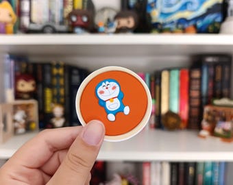 Sticker - Doraemon lying in a Dorayaki