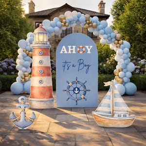 May include: A nautical-themed baby shower setup with a lighthouse, anchor, and sailboat decorations. A blue archway with the text "AHoy, it's a Boy" is in the center. The decorations are in shades of blue, white, and gold.