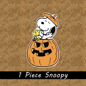 May include: A die-cut sticker featuring the white cartoon character Snoopy wearing an orange hat and sitting inside a carved orange jack-o'-lantern with a yellow Woodstock figure. The text 1 Piece Snoopy is printed in white at the bottom.