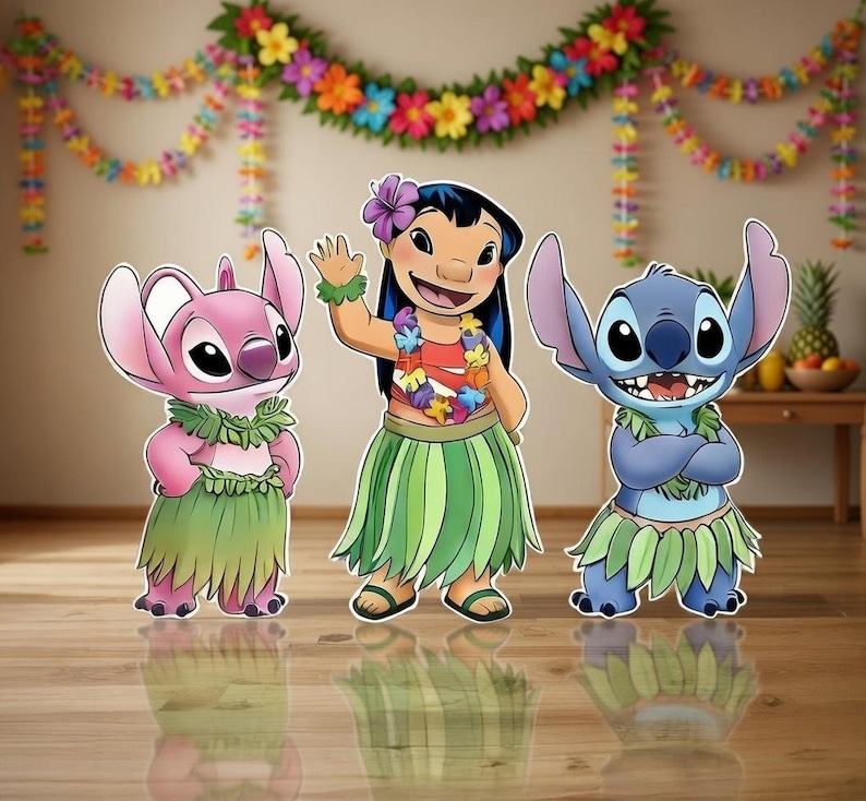 May include: Three cartoon cutouts of characters from the animated film Lilo & Stitch. The characters are Lilo, Angel, and Stitch, each wearing Hawaiian-themed attire. A colorful floral garland hangs in the background, creating a festive atmosphere.
