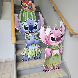 May include: A white ceramic mug with a black handle and the text "But first, coffee" in a black, handwritten-style font. The mug is on a white surface.