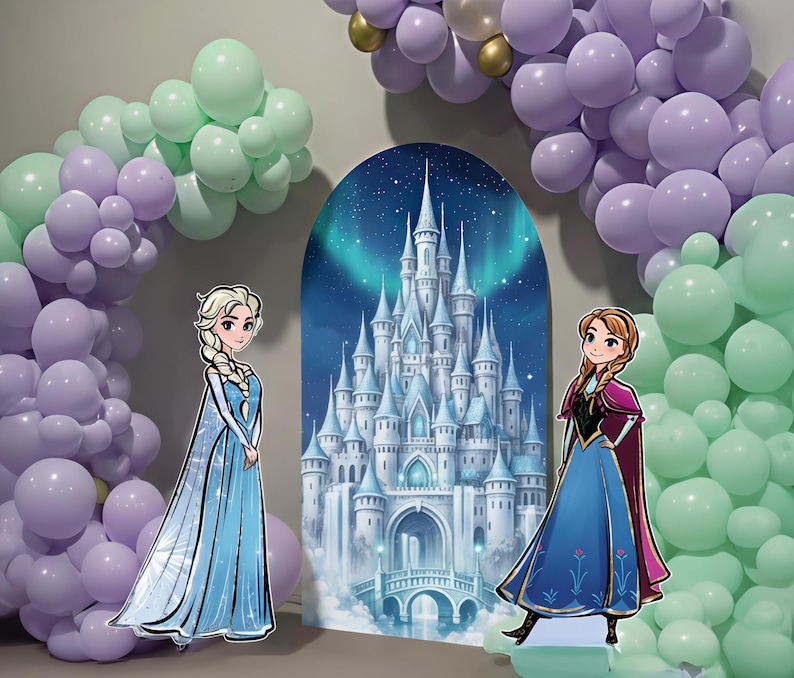 May include: A party scene featuring a backdrop of a castle with a night sky and aurora borealis. Two cardboard cutouts of cartoon characters stand in front of the backdrop. The scene is decorated with balloon arches in shades of purple, green, and gold.
