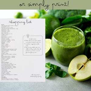 May include: A spiral-bound shopping list with handwritten text, alongside a glass of green smoothie, apple slices, and fresh greens. The list includes ingredients for recipes, with the text "or simply print!" at the top.
