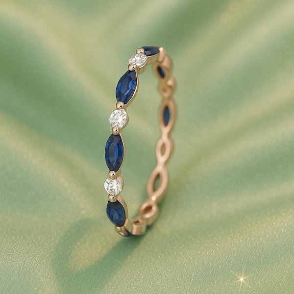 Anillo de bodas de oro rosa con zafiro azul y moissanita talla marquesa