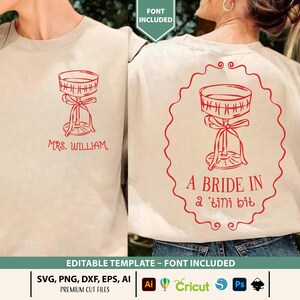 May include: Beige sweatshirt with a red cocktail glass design. The front reads "MRS. WILLIAM" and the back says "A BRIDE IN a 'tini bit". Includes editable template and font. SVG, PNG, DXF, EPS, and AI files.