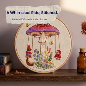 Könnte beinhalten: Ein Stickrahmen mit einem gestickten Motiv eines großen Pilzes mit violettem Hut, der als Karussell für ein Eichhörnchen und einen Igel auf Schaukeln dient. Der Text lautet A Whimsical Ride, Stitched. Pattern PDF + full tutorial. 3 sizes.
