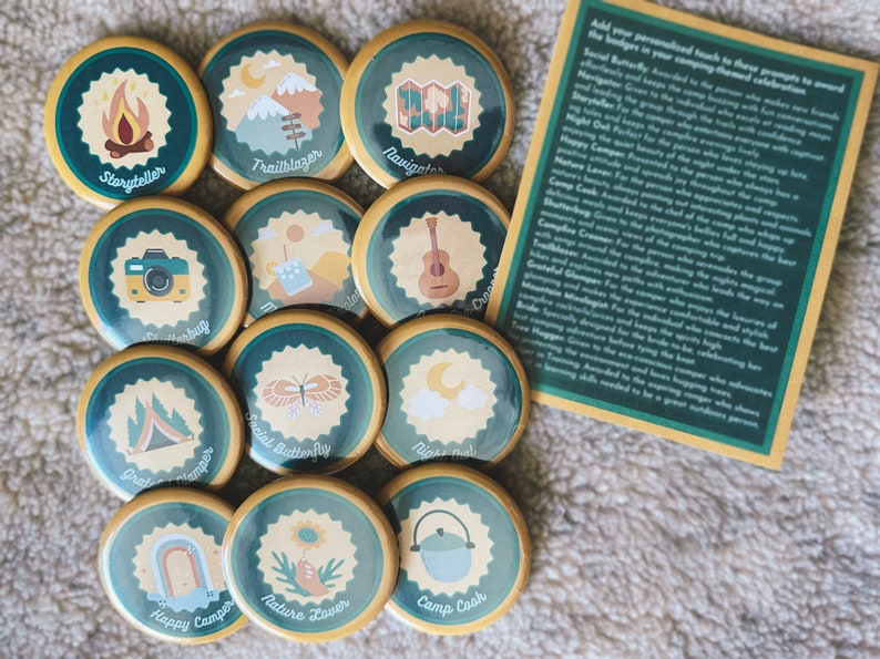 12 pinback buttons with a camping merit badge theme
