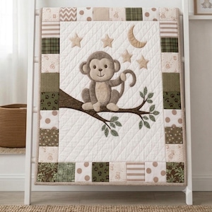 May include: A quilted baby blanket featuring a central appliqué of a brown monkey sitting on a dark brown tree branch. The centre panel is cream with four tan stars and a crescent moon. The border consists of patchwork squares in olive green, tan, and cream with patterns including polka dots, stripes, plaid, and animal paw prints.