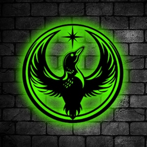 May include: A circular wall art piece with a black bird design and green neon illumination. The bird has outstretched wings and is set against a dark grey brick wall. The art includes a star above the bird.