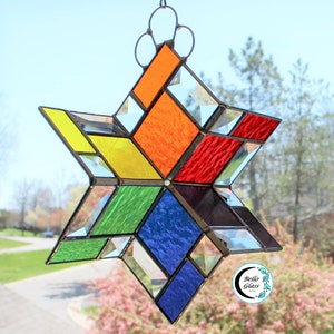 3D stained glass spinner. Twirling rainbow colors. Hanging beveled prism sun catcher for inside or outside. Expertly handcrafted home decor