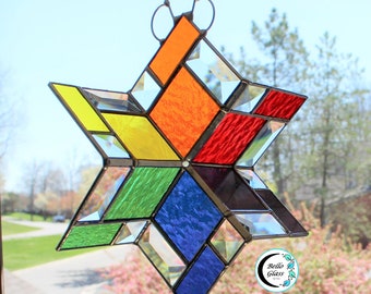 3D stained glass spinner. Twirling rainbow colors. Hanging beveled prism sun catcher for inside or outside. Expertly handcrafted home decor