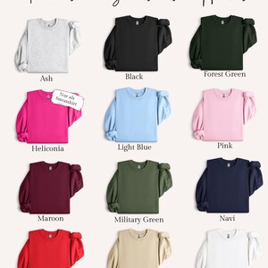 May include: A selection of sweatshirts and hoodies in various colors, including ash, black, forest green, heliconia, light blue, pink, maroon, military green, navy, red, sand, and white. The text "Farbauswahl Sweatshirts & Hoodies" is at the top.
