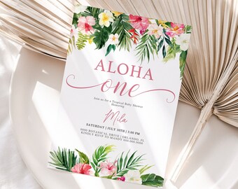 May include: A tropical-themed baby shower invitation with pink and green floral accents. The text reads "ALOHA one" and "Join us for a Tropical Baby Shower Honoring Mila". The date and time of the event are listed as "SATURDAY | JULY 30TH | 3:00 PM" and the location is "0000 BOTANICAL DRIVE | ORLANDO, FL". The invitation also includes the RSVP information: "KINDLY RSVP TO MANDY 000.000.0000".