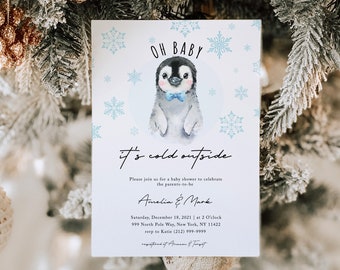 May include: A baby shower invitation with a cute penguin illustration. The invitation is white with blue snowflakes and the text "Oh Baby it's cold outside". The invitation includes the names Amelia & Mark, the date and time of the shower, and the address.