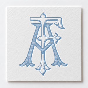 May include: A square white card featuring a debossed monogram of the letters A and F intertwined. The letters are rendered in a light blue color with fine horizontal line shading throughout the characters, creating a textured and dimensional appearance.