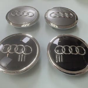 NEUE 4 Stück 60/61/68/69 mm Audi Schwarz/Grau Nabenkappen Radkappen Embleme