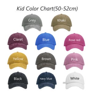 May include: A color chart of children's baseball caps in various colors, including grey, khaki, claret, blue, rose red, yellow, brown, pink, black, navy blue, and white. The text "Kid Color Chart (50-52cm)" is at the top.