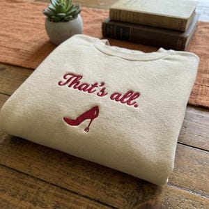 May include: A distressed wooden sign with the words "Welcome to our home" in white. The sign has a rustic finish, ideal for adding a welcoming touch to any home's entrance.