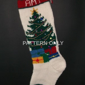 May include: White knitted Christmas stocking with a green Christmas tree design, red and green trim, and the name "AMY" embroidered on the cuff.
