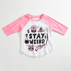 Stay Weird Solid White/Pink Raglan Kids T-Shirt. 3/4 length baseball child tee. Spooky, magic shirt for Boys and Girls