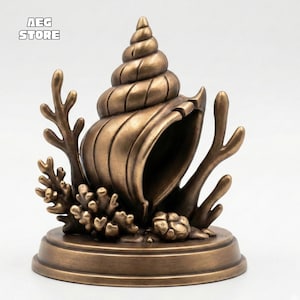 Peut inclure: Sculpture en forme de coquillage de couleur bronze, avec des détails de coraux et d'algues. Le coquillage présente des nervures en spirale et repose sur une base ronde. Finition métallique, pour la décoration intérieure.