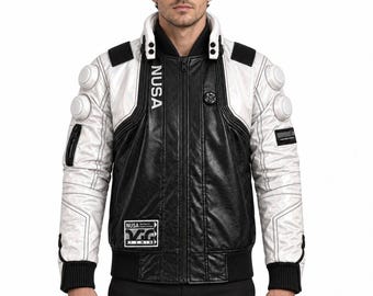 May include: A black and white jacket featuring a high collar, a full-length front zipper, and ribbed cuffs. The design includes white sleeves with circular padded accents, black shoulder panels, and the text NUSA printed vertically on the chest.